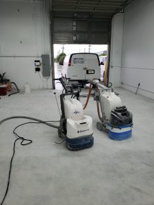Skilled professional using a high-grade polishing machine to meticulously restore and shine a marble floor, demonstrating expert floor care and maintenance.