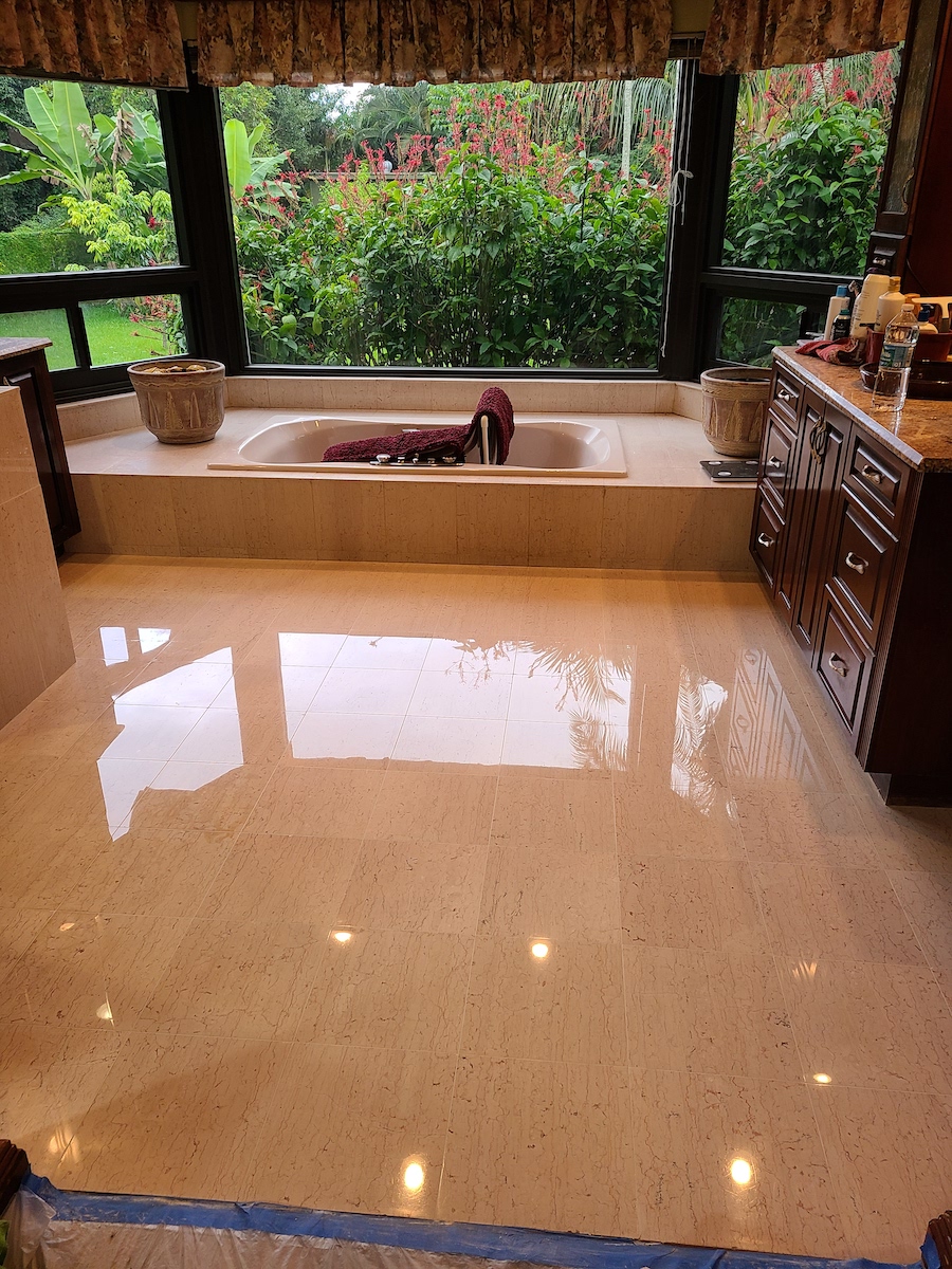 image of a Polished Marble bathroom floor with a high-gloss finish, expertly restored by First Class Marble Restoration in Pembroke Pines.